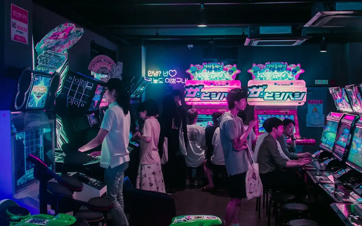 Girls dancing in formation on stage with bright lights, a dynamic K-pop performance