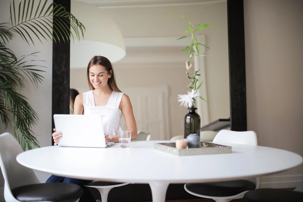 Hotels marketing remote work retreats to digital nomads with laptops and tropical views