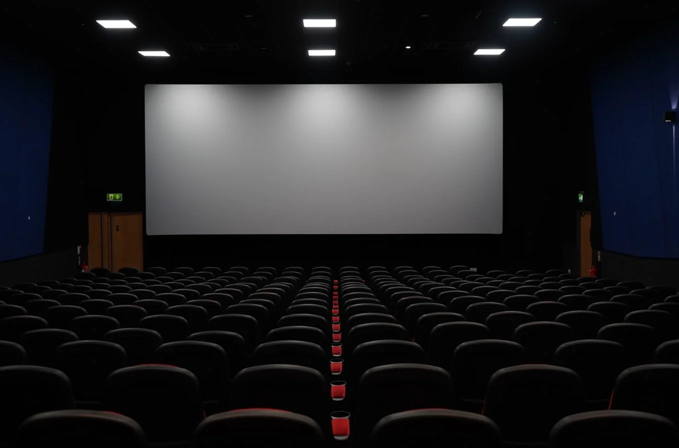 AMC Theatres logo illuminated as a sign of potential financial trouble