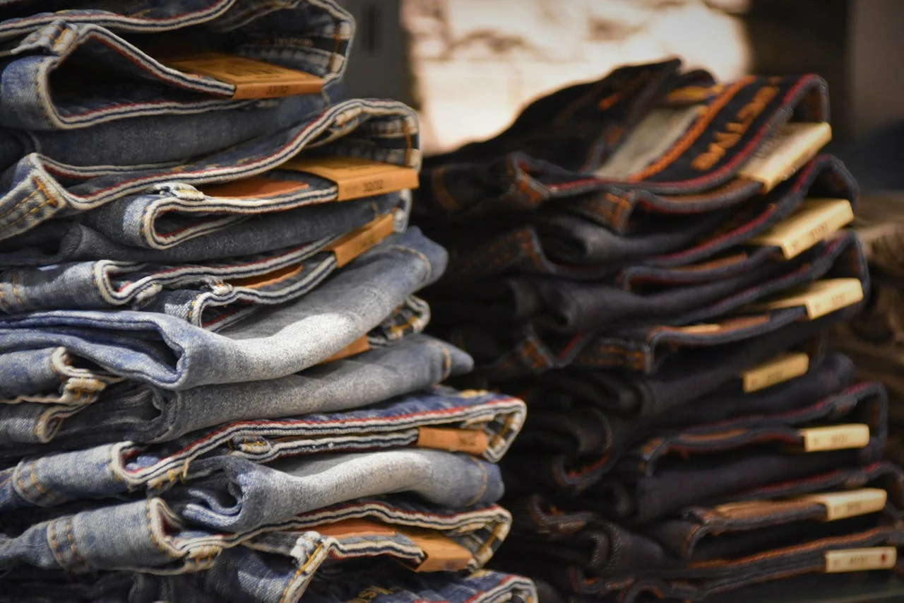 Fashion PR professional presenting clothing brand at a bustling industry event