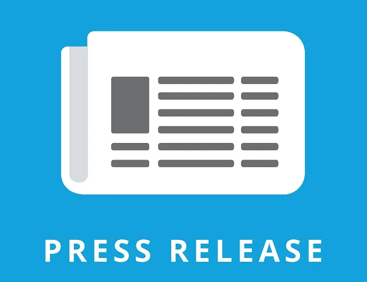 Journalist reading a digital press release on a tablet, optimal timing for outreach