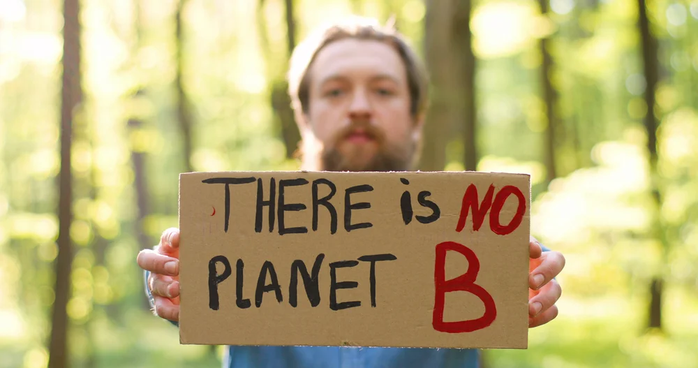 People hold protest signs, showcasing brands actively supporting social change initiatives