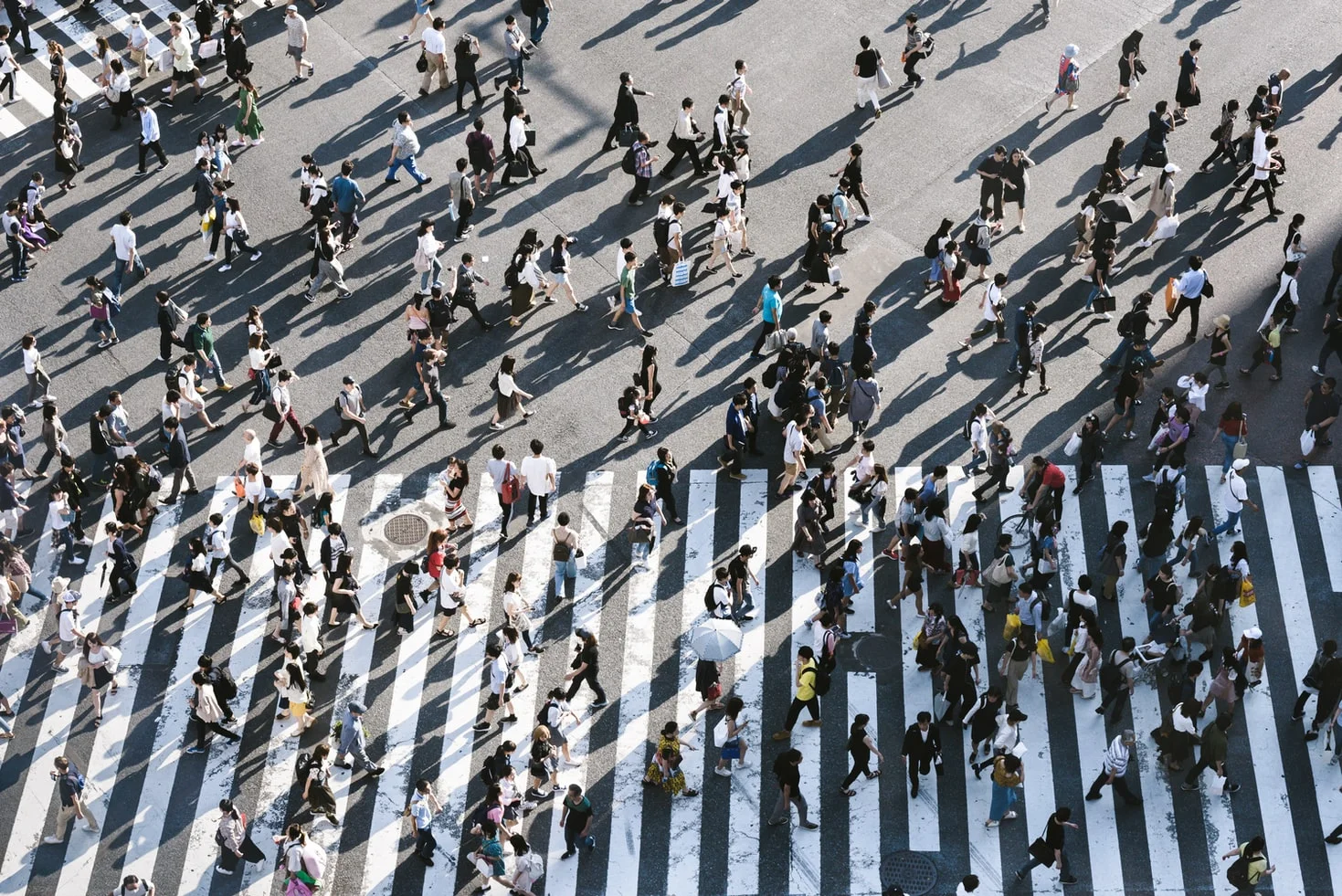 A diverse group of people engaged in consumer behavior and decision-making