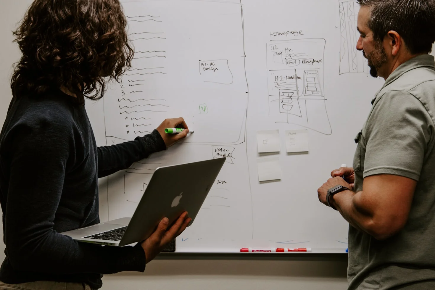 Woman creating content at desk, planning social media influencer marketing strategy