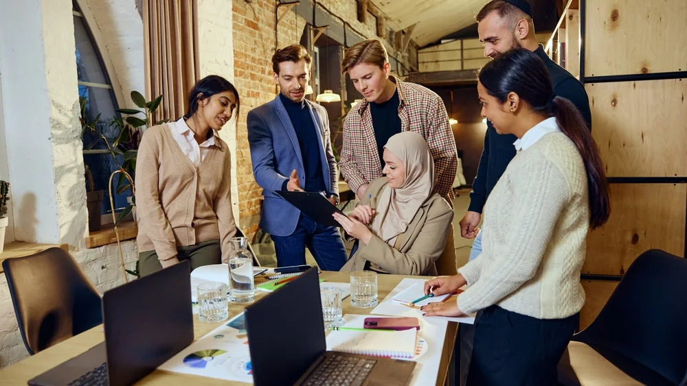 Diverse individuals collaborating inclusively, showcasing authentic representation and belonging in modern workplaces