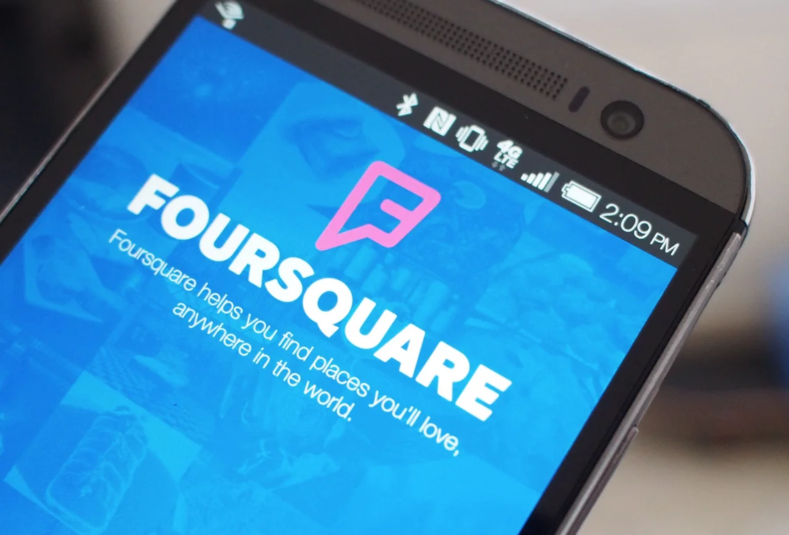 An illustrated character in a suit stands on steps labeled "Leadership" and "Foursquare