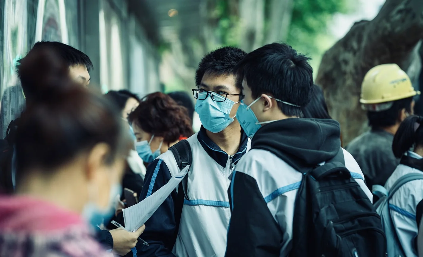 Young woman with face mask and sad expression during COVID-19 pandemic