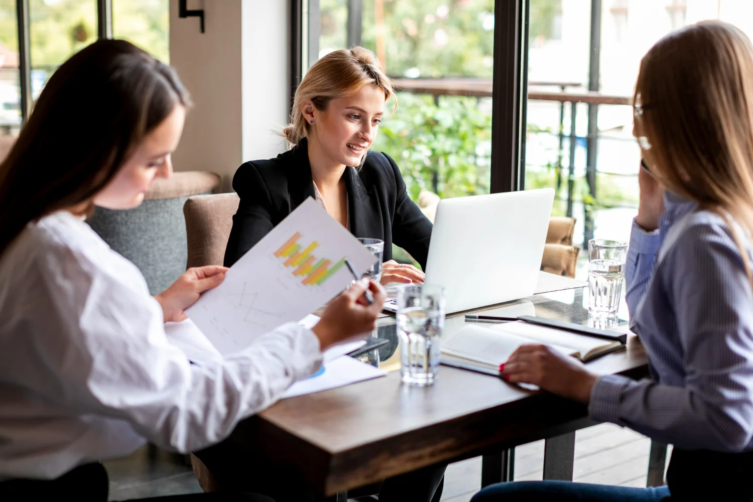 B2B tech PR firm professionals launching a product with an upward-trending graph