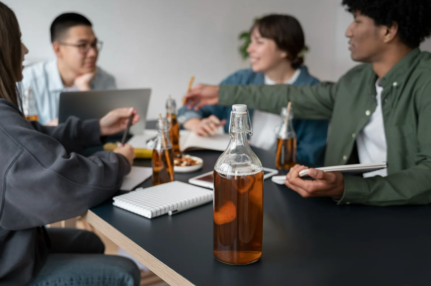 Alcohol marketing agency team collaborating in a modern office, driving brand growth
