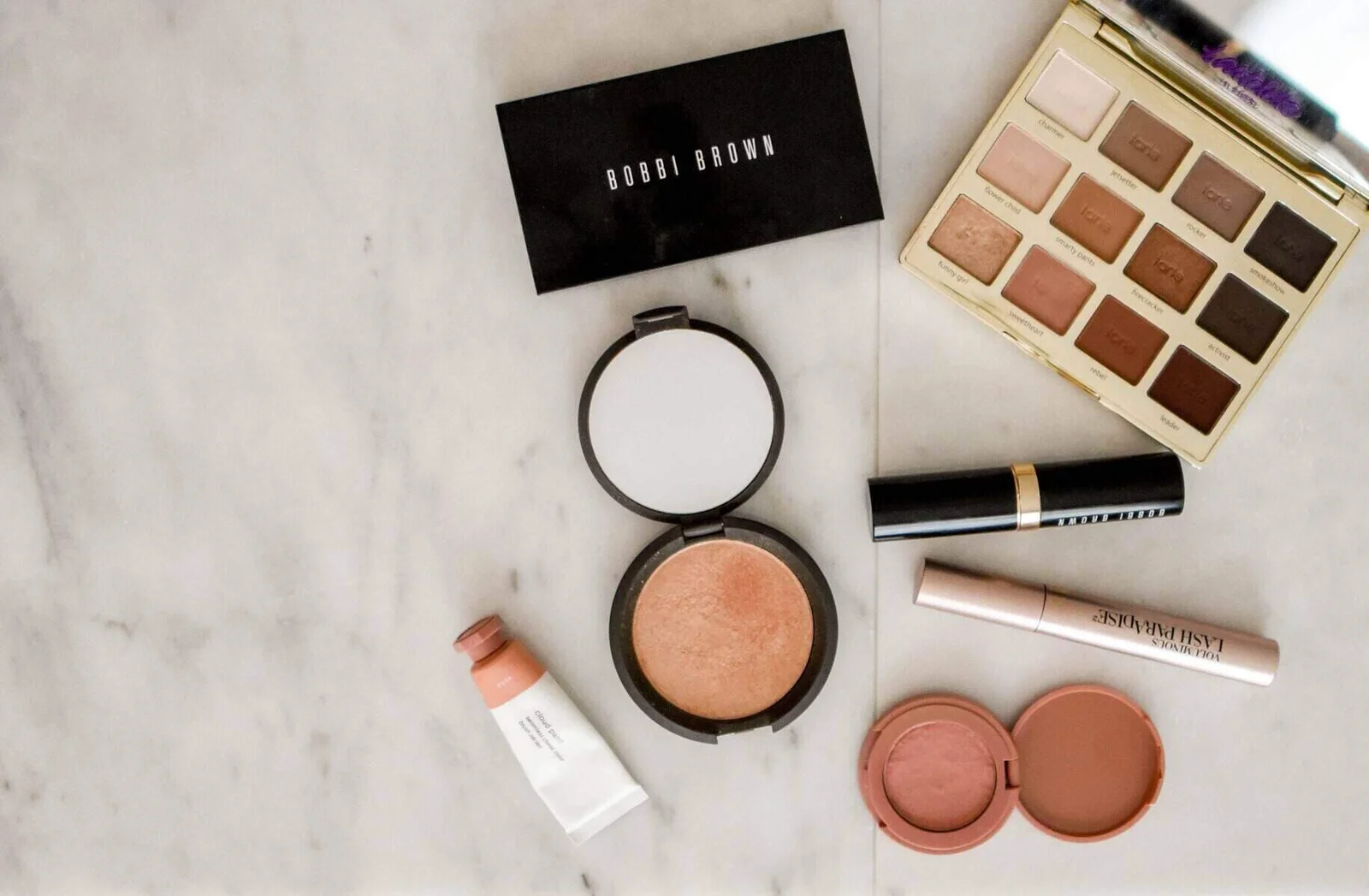 Woman with natural makeup looks at camera, symbolizing genuine beauty in the industry