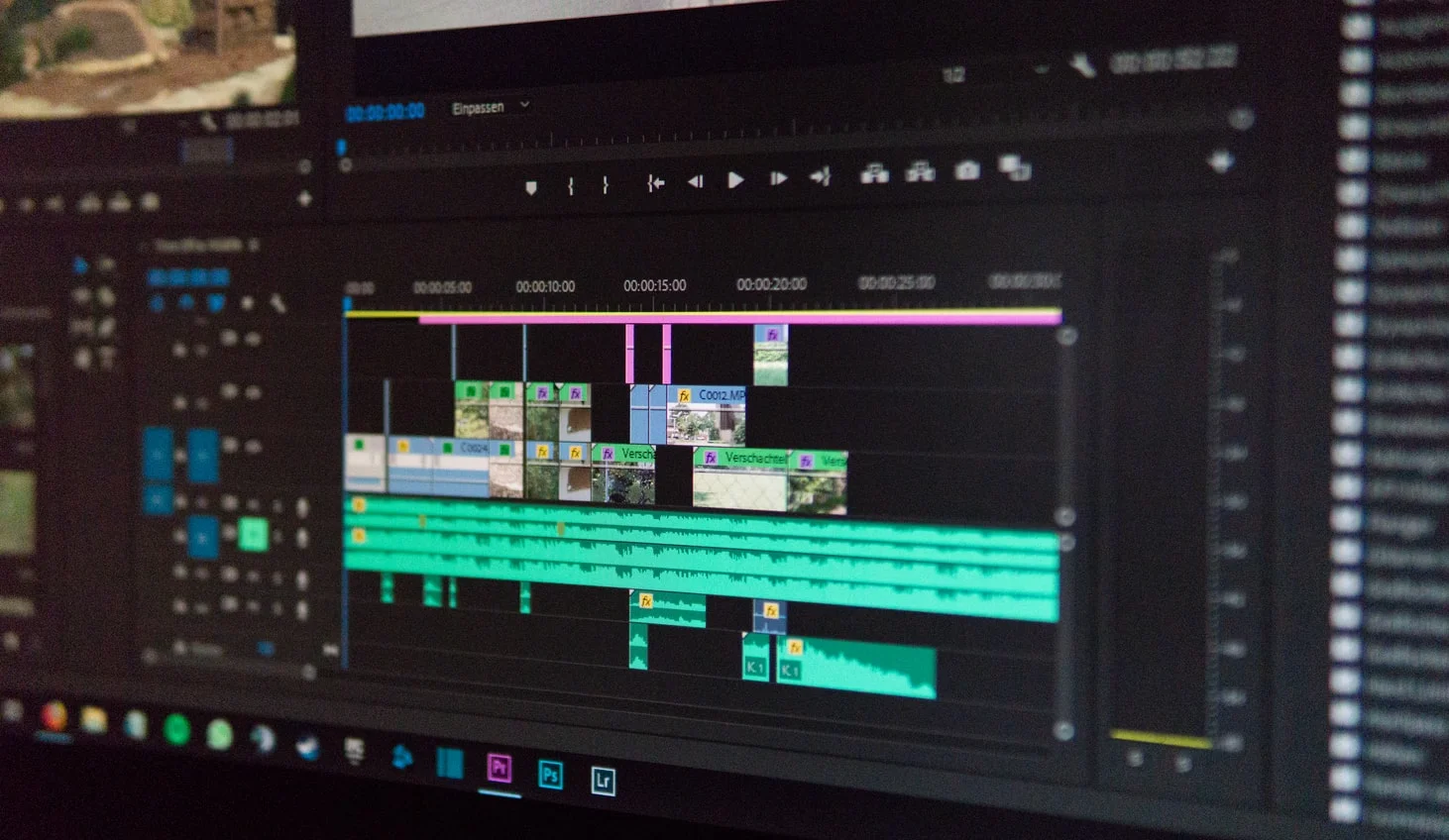 Hands adjusting video marketing tactics on a digital screen, showcasing business growth strategies