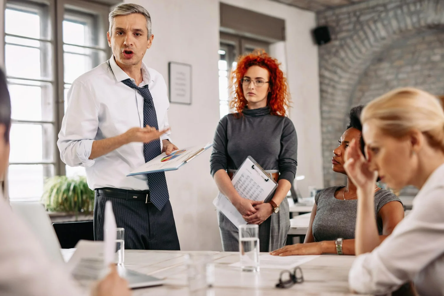 A diverse group of professionals collaborating, suggesting knowledge sharing and industry expertise