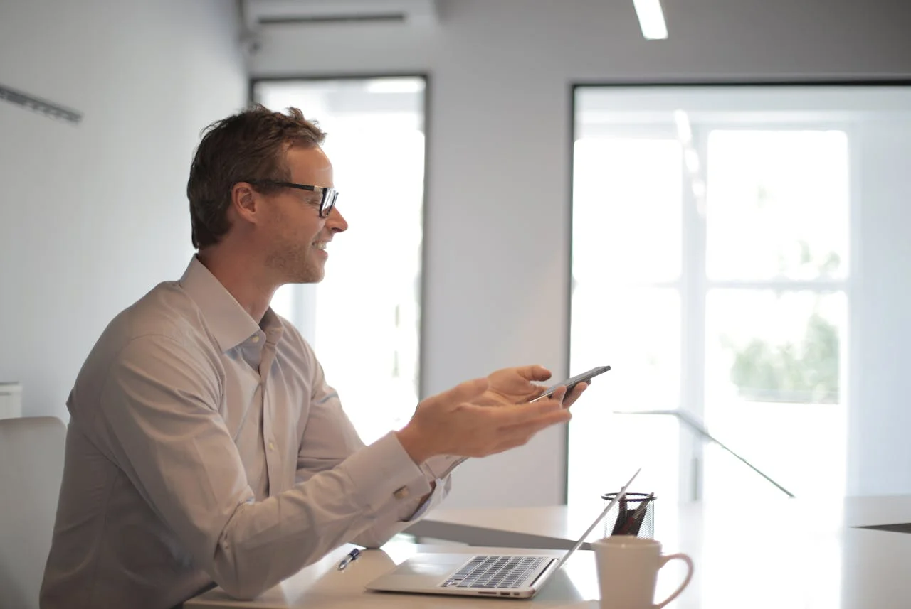 A diverse group of professionals collaborating, sharing knowledge and expertise in a modern office