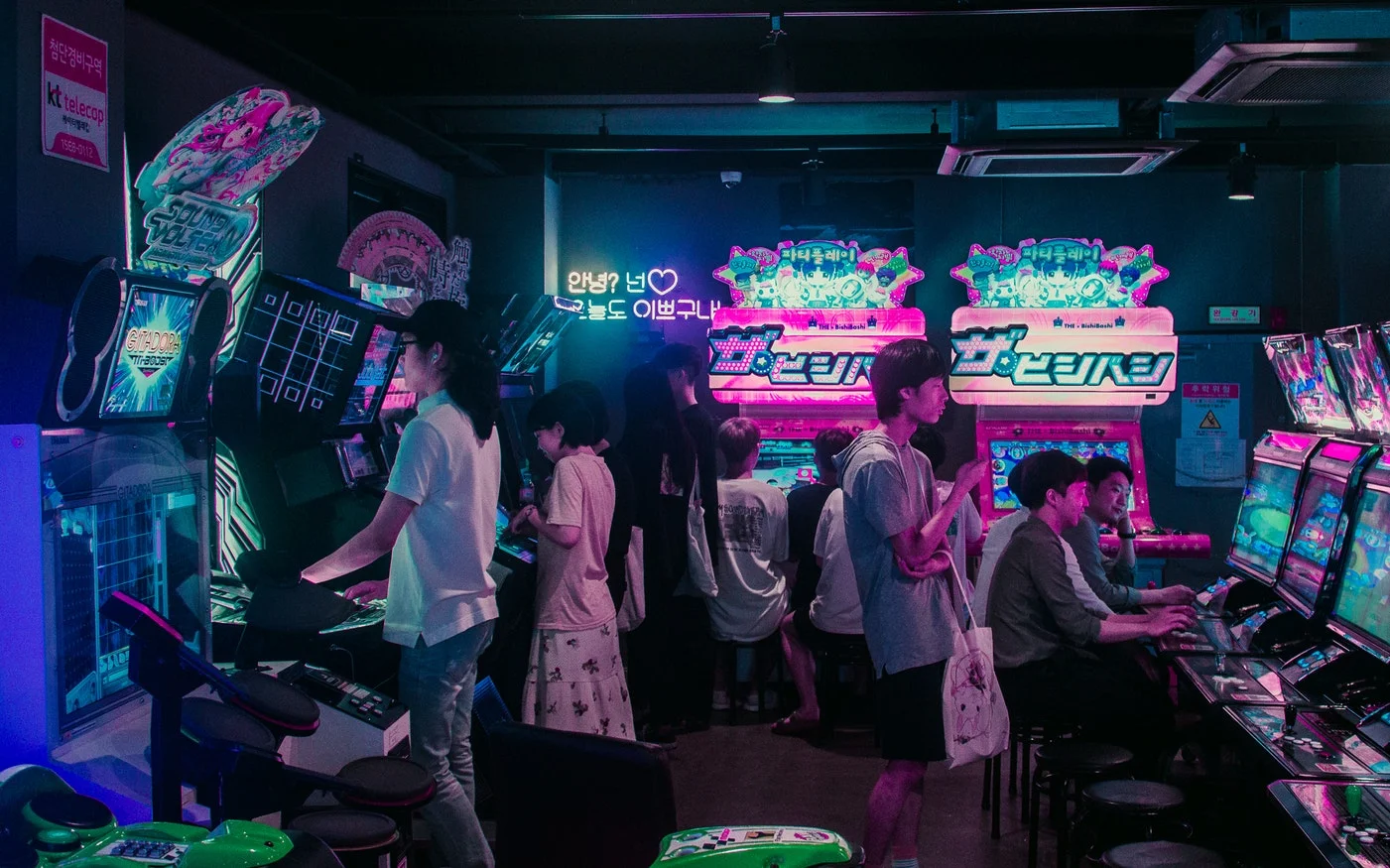 Girls dancing in formation on stage with bright lights, a dynamic K-pop performance