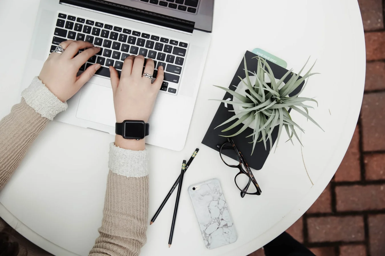 Marketers look glumly at a burnt-out marketing strategy on a scorched laptop