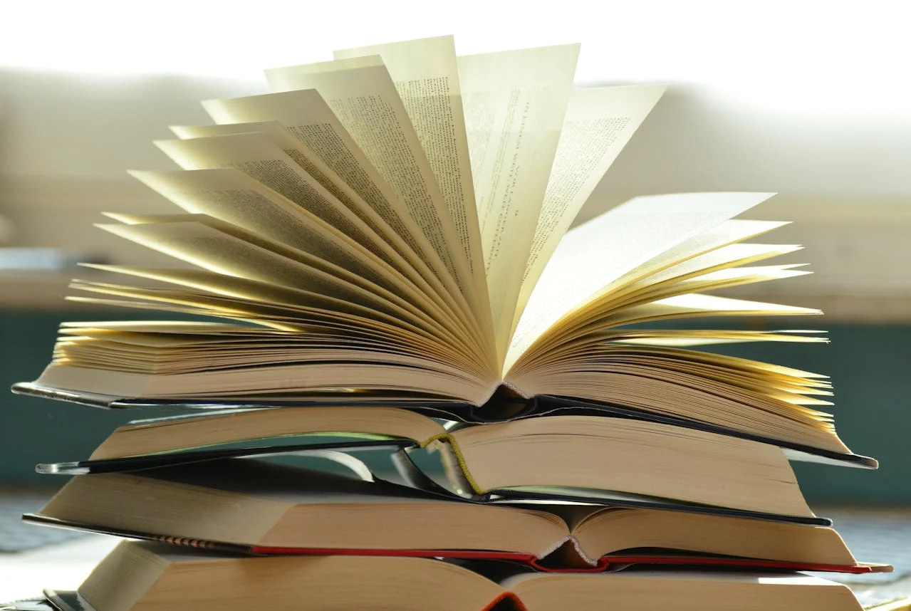 Author holding an open book, showcasing effective strategies for marketing success