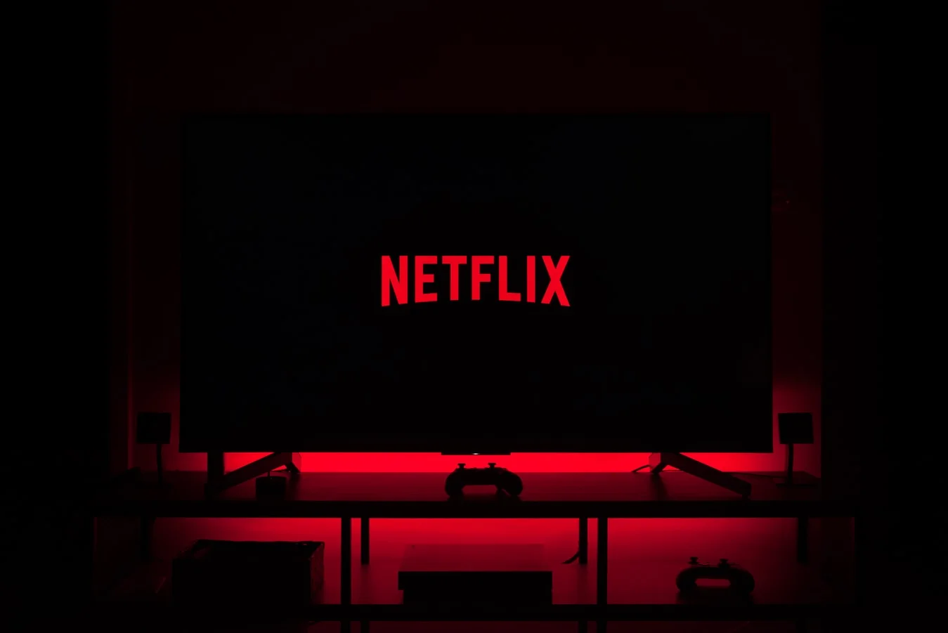 Netflix logo glowing on a screen, showcasing its entertainment power