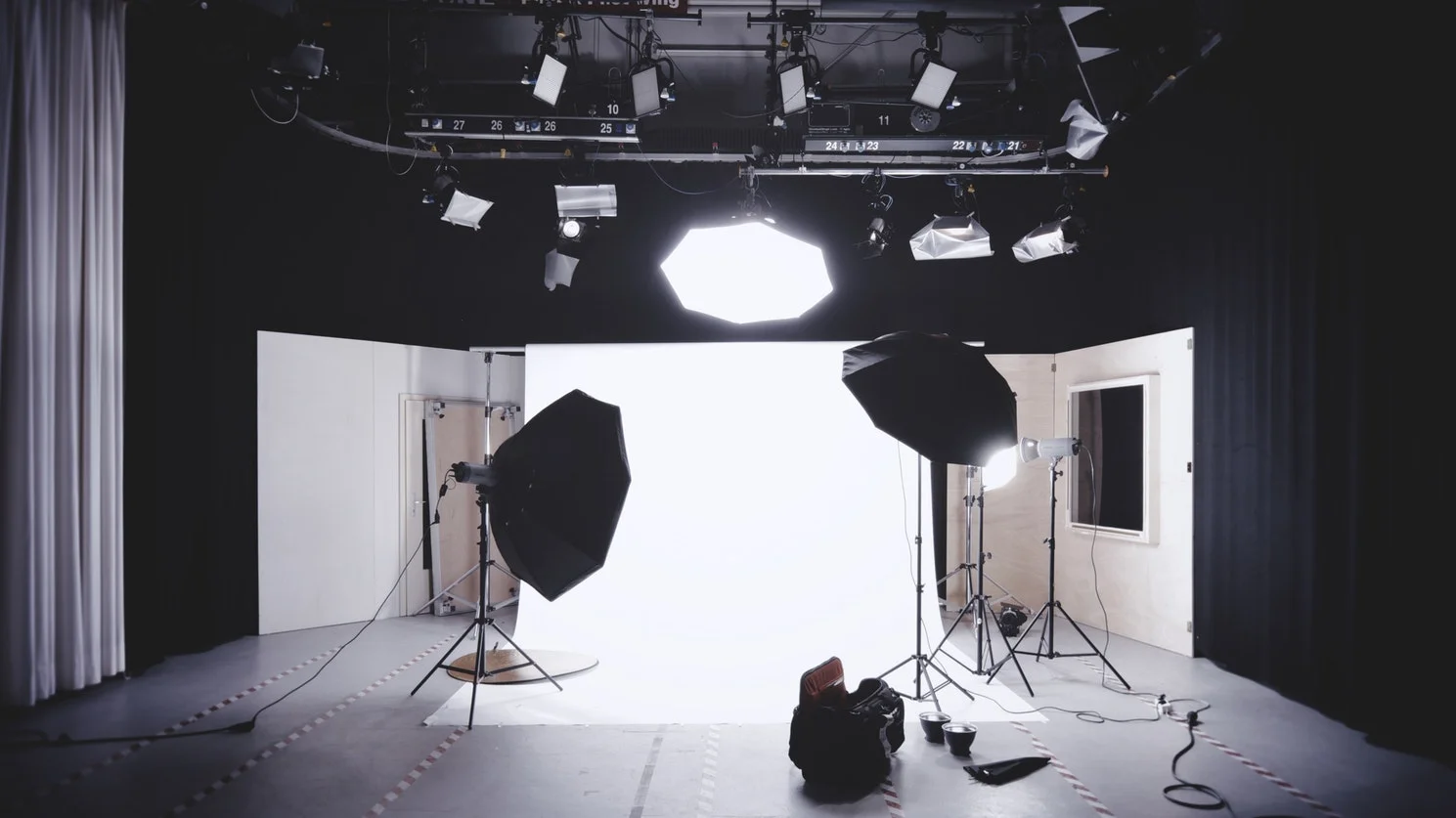 Professional photographer adjusts settings, showcasing quality photography's marketing impact