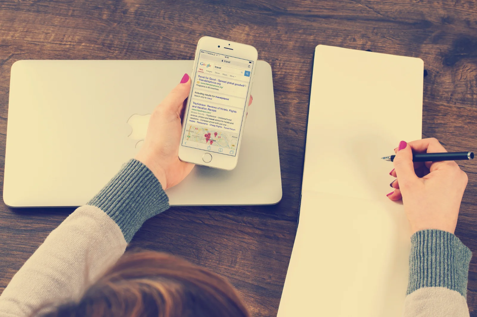Magnifying glass highlighting "SEO" on a marketing strategy document, emphasizing its importance