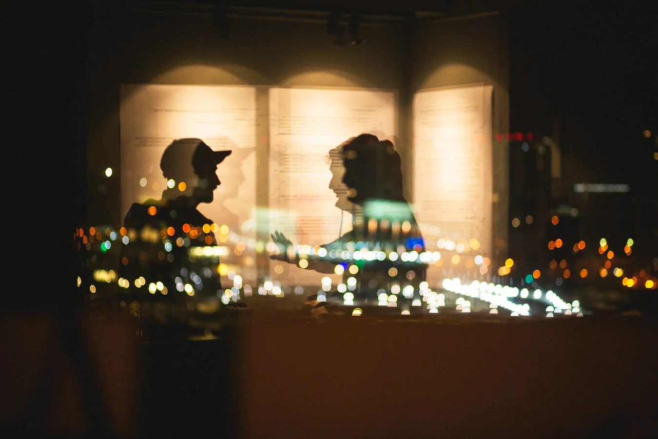 A person wearing a mask speaks on a megaphone, adapting communication in crisis