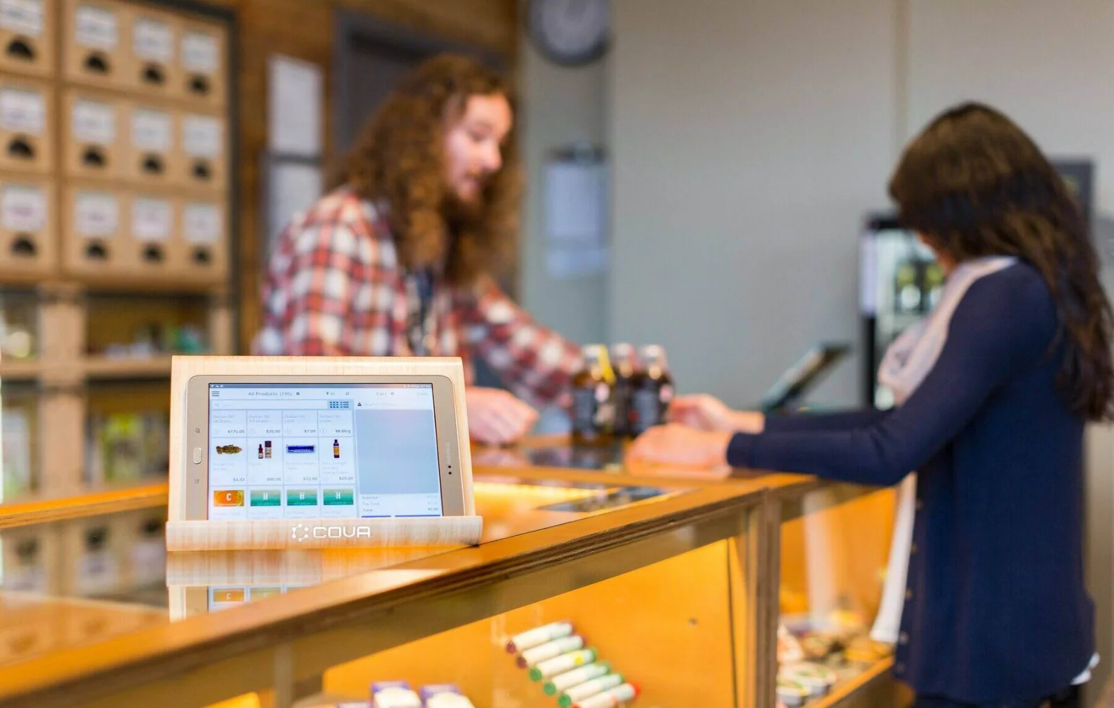 CBD product on a retail shelf next to a smartphone showing direct-to-consumer sales
