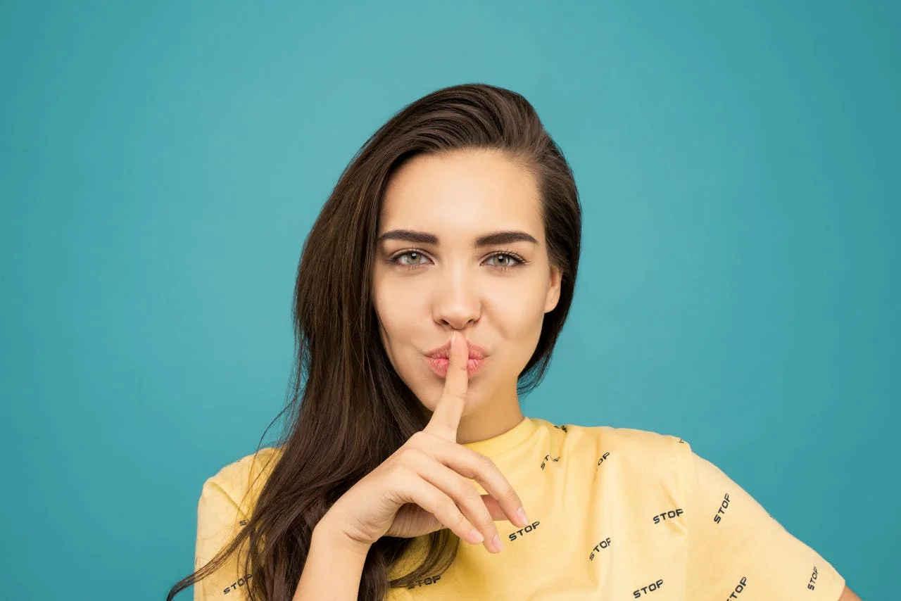 Elegant woman thoughtfully considering her words, symbolizing the power of silence in PR