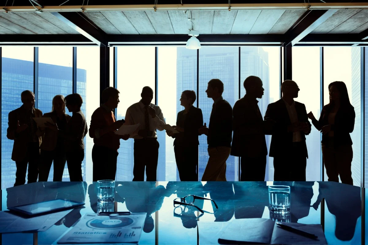 Diverse team collaborating, embodying transparency and trust in internal communications