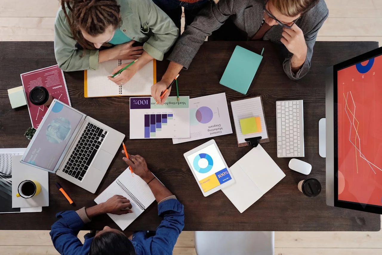 Team collaborates on software development during an internal company hackathon event