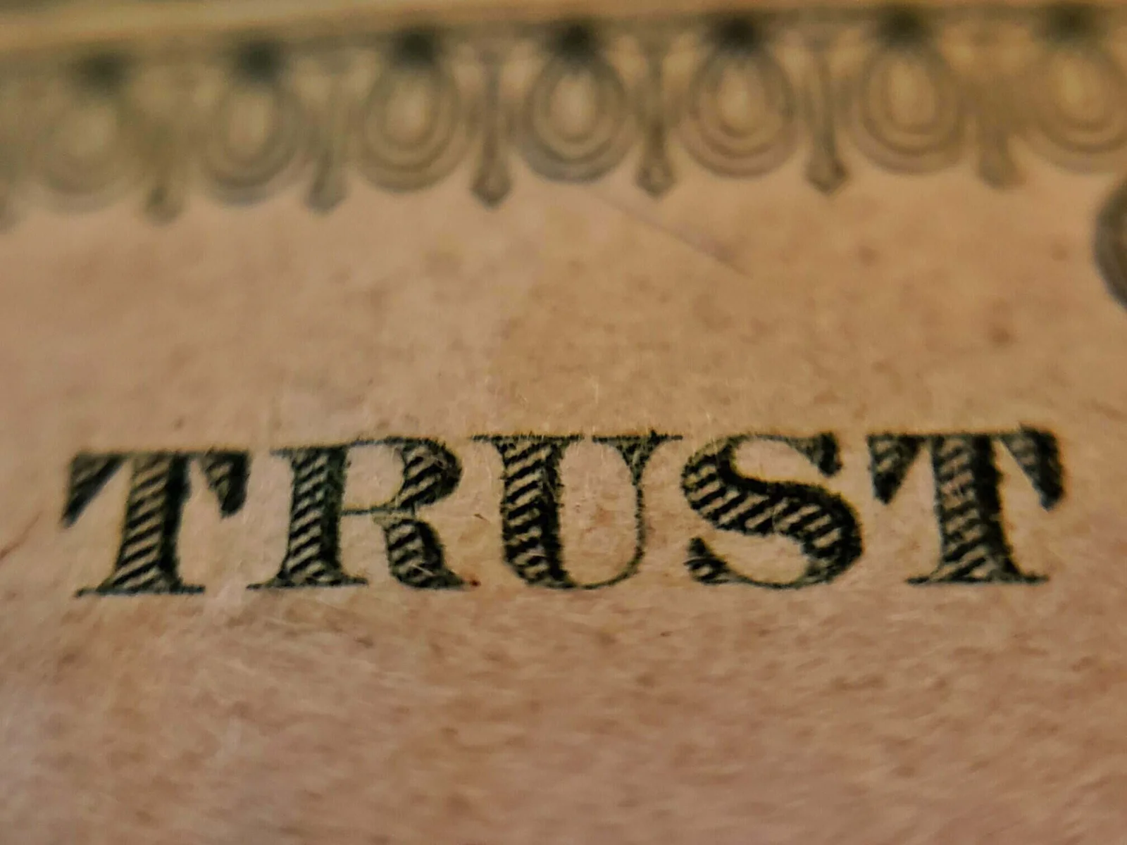 Hands shaking across a table, symbolizing trust and diverse collaboration in global marketing