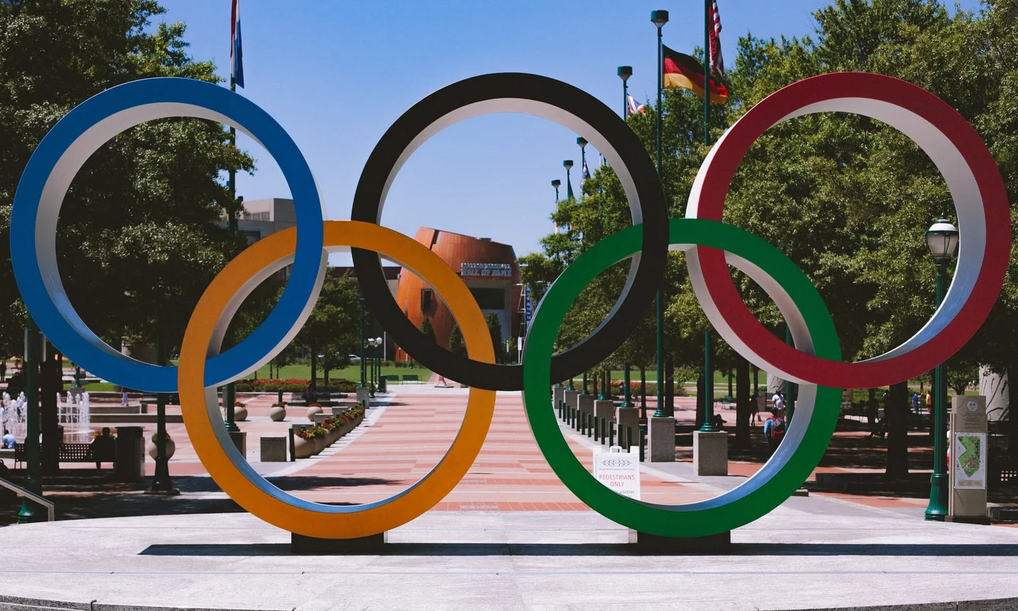 A panoramic view of the iconic Olympic rings floating in Tokyo Bay