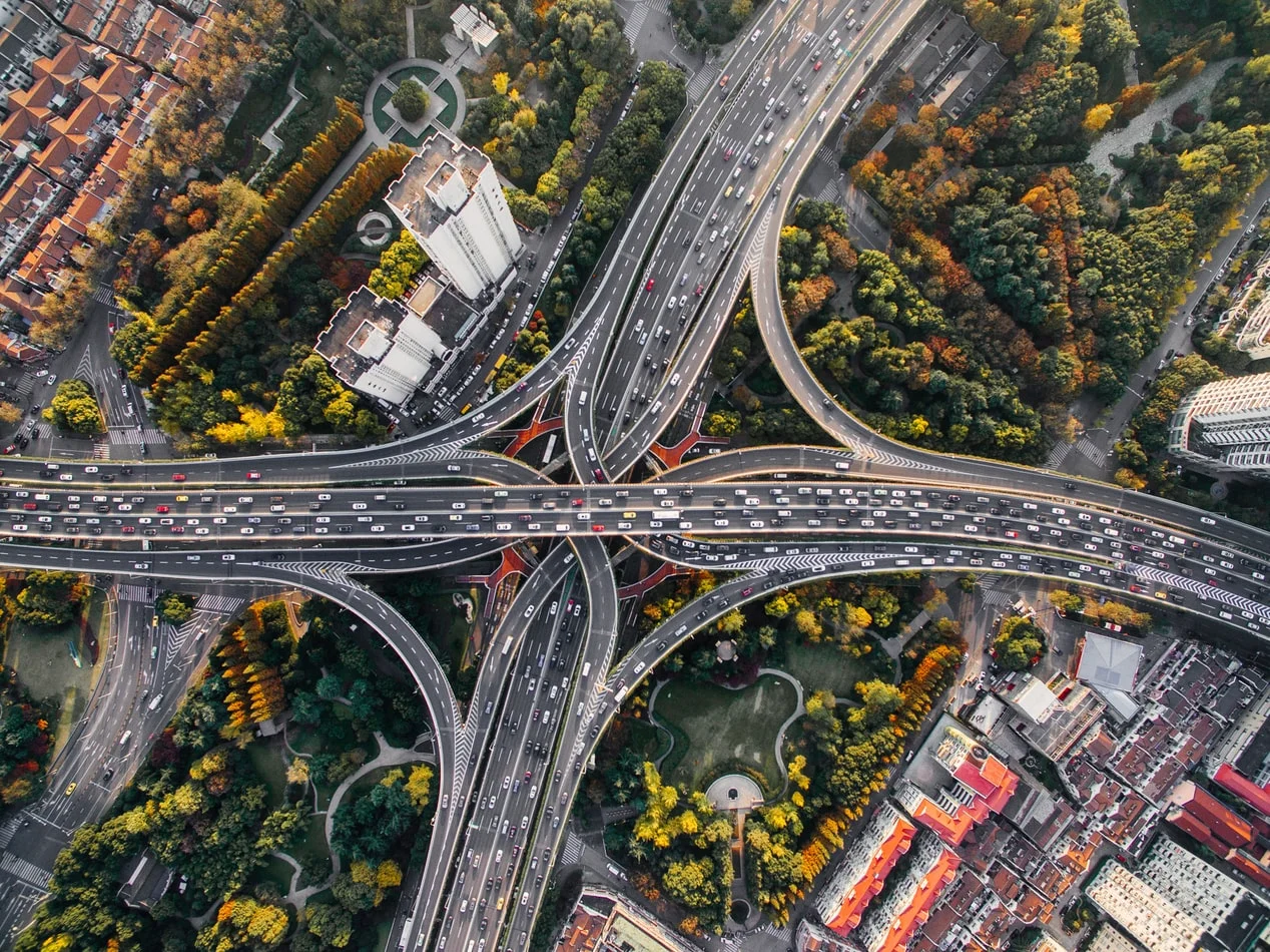 Road filled with cars, stopped in a frustrating city traffic jam