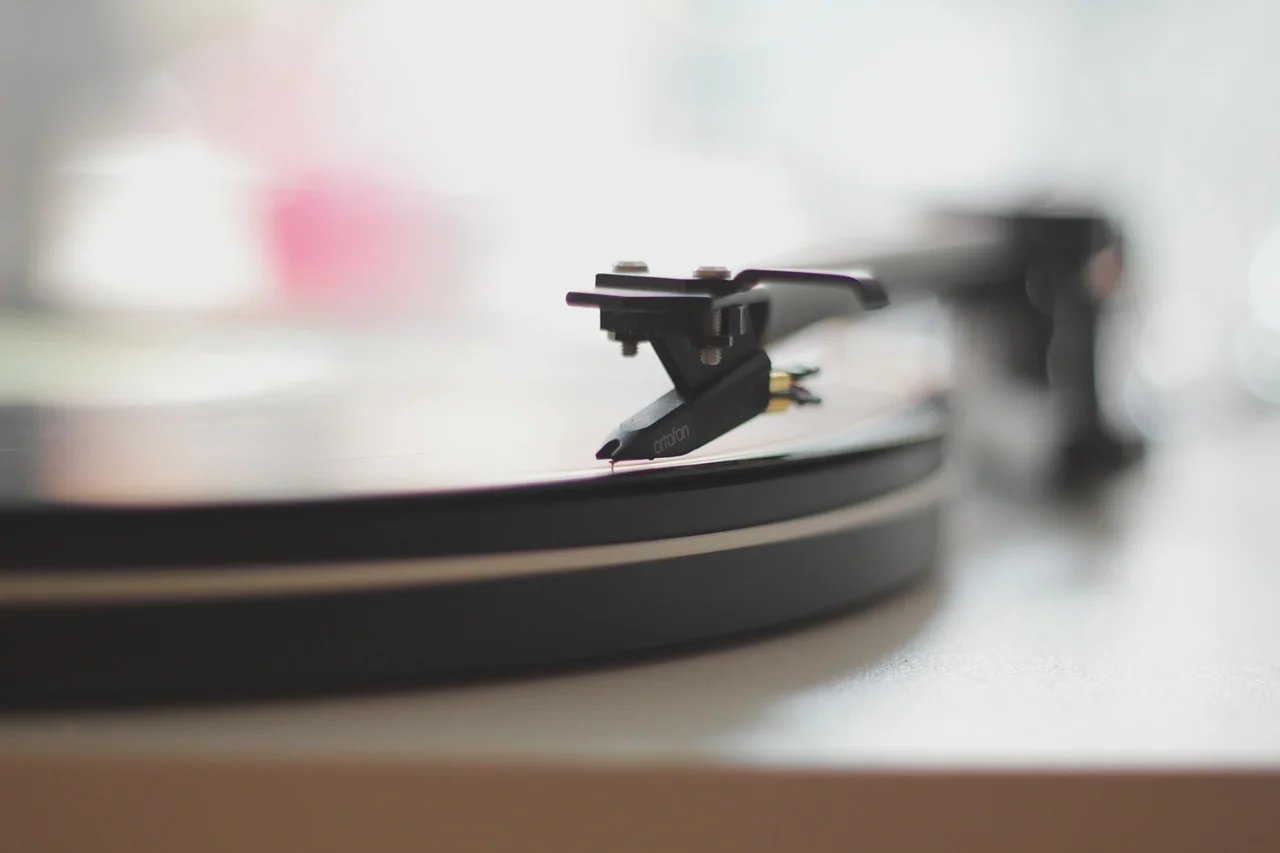 Vintage vinyl records spinning on a turntable, showcasing the music industry's resurgence
