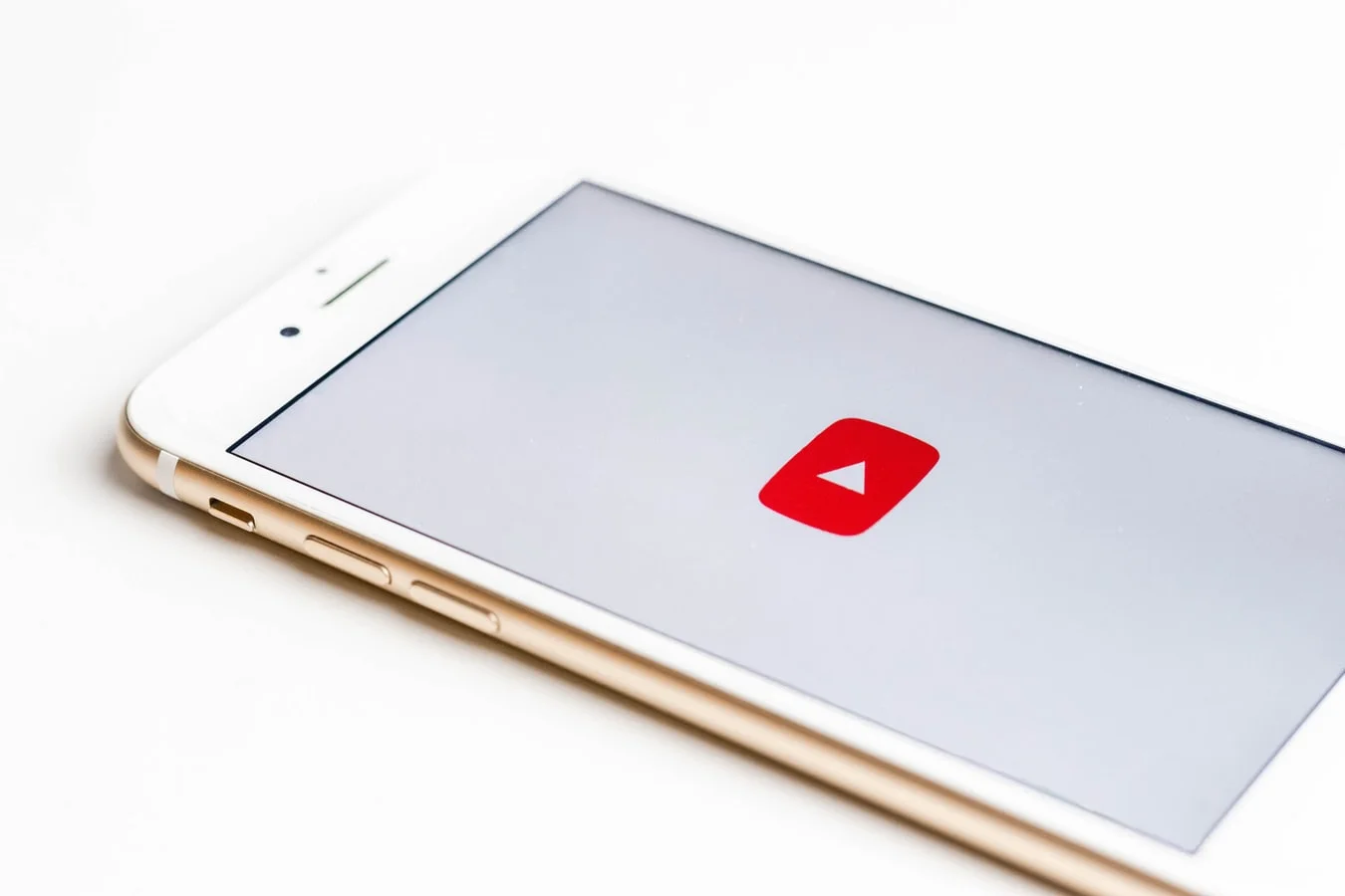 Young woman records video on smartphone for YouTube, aiming for viral success