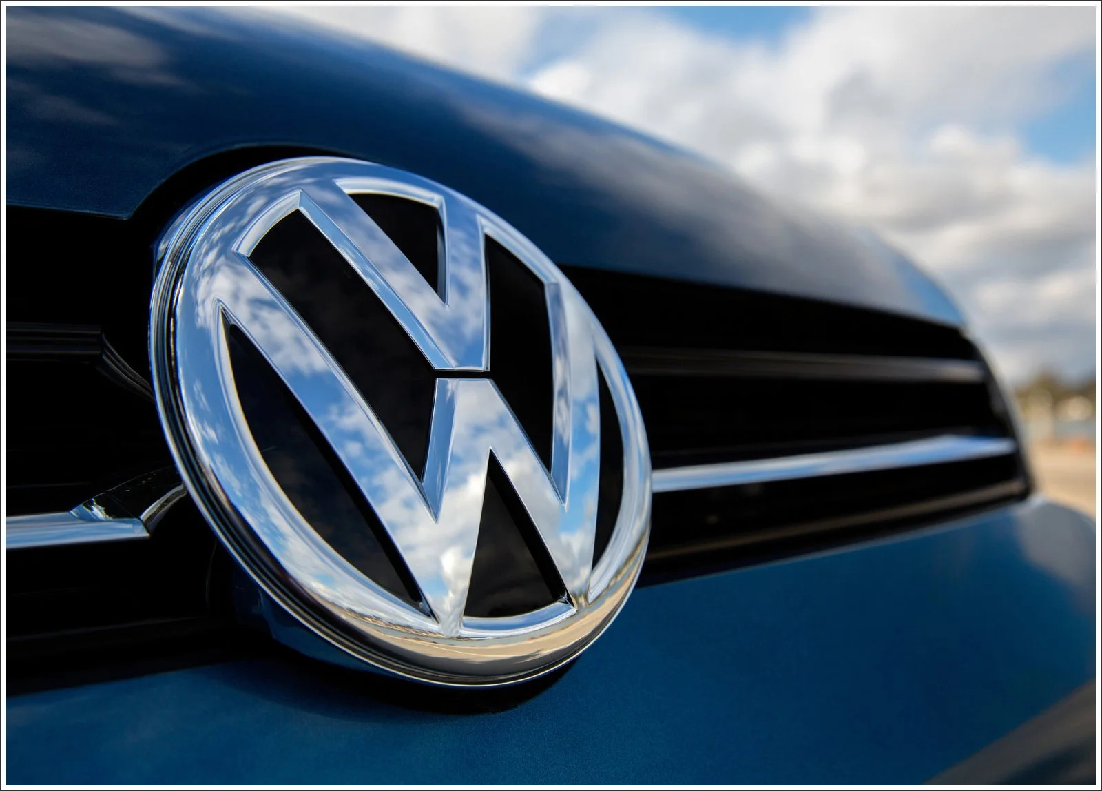 Volkswagen car on a road at sunset, symbolizing a change in direction