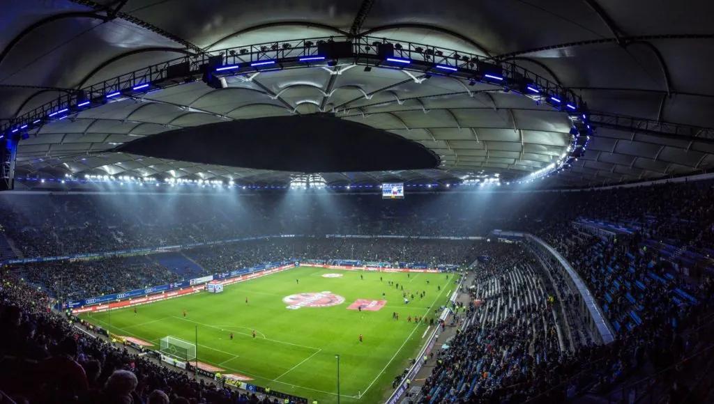A packed football stadium seen from the stands
