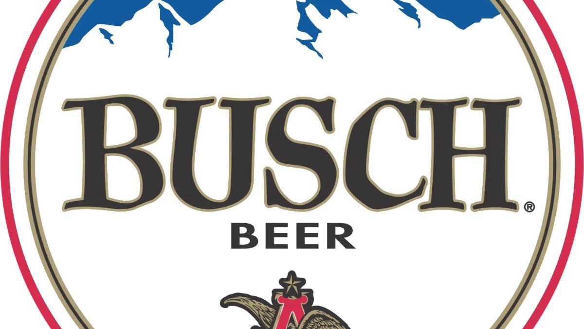 Busch beer cans and laptop on a desk, symbolizing new remote work environment