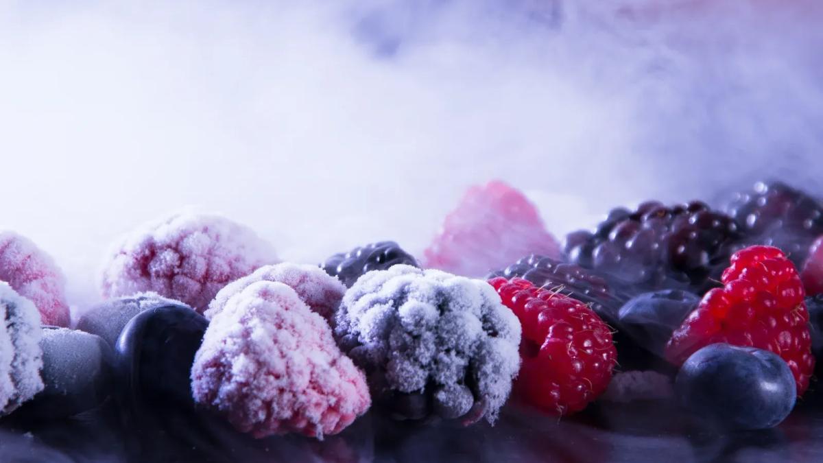 Frozen food recall: hands sorting through packages on a factory line