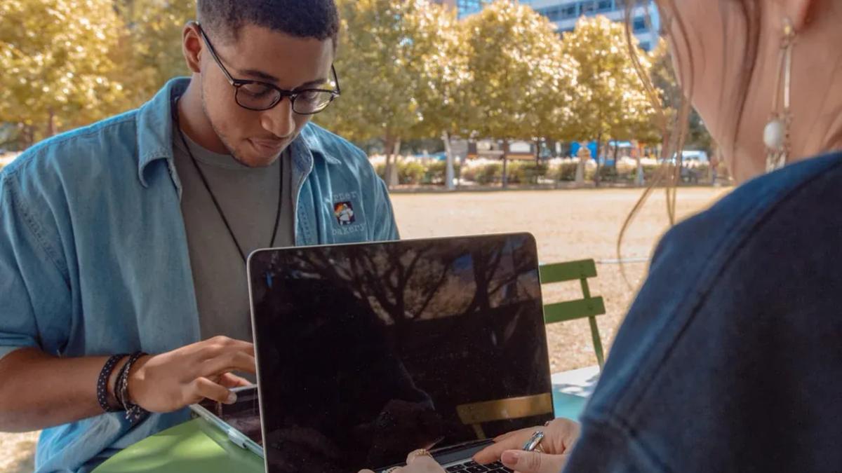 Diverse Gen Z individuals engaging with technology and social media for marketing strategies