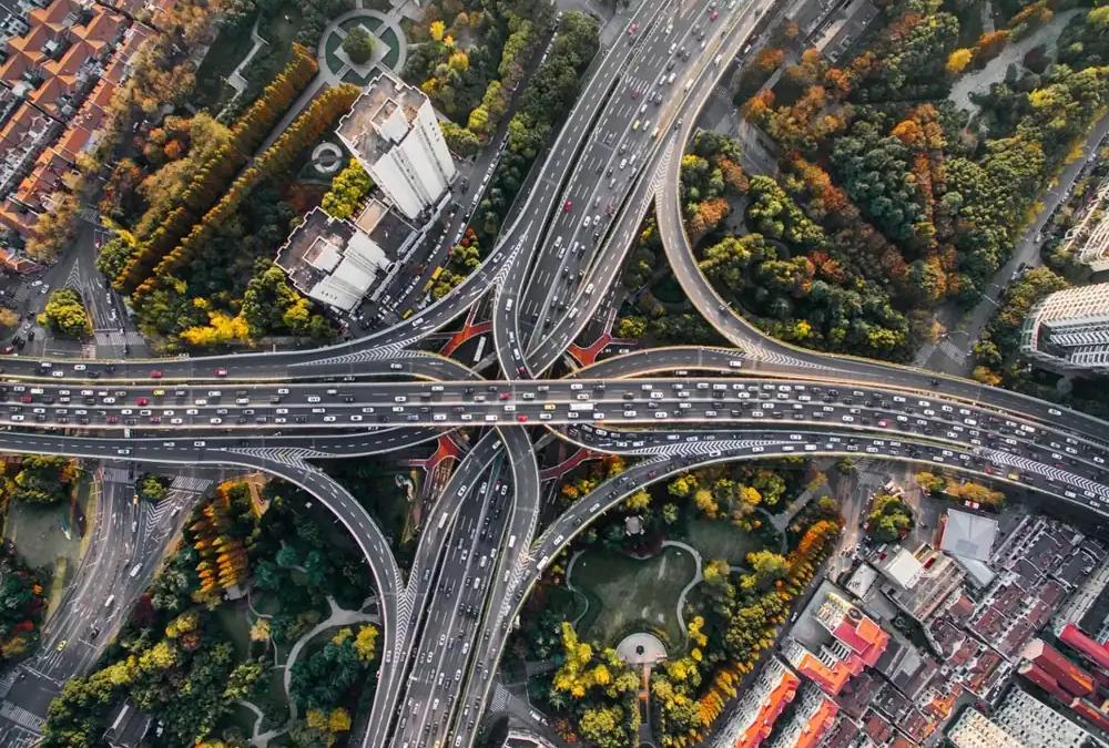 Road filled with cars, stopped in a frustrating city traffic jam