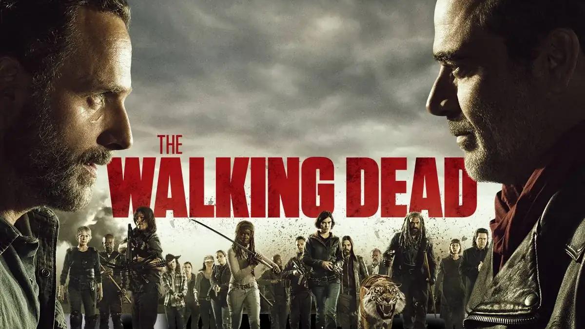 A large group of diverse zombie extras on set, walking together through a city