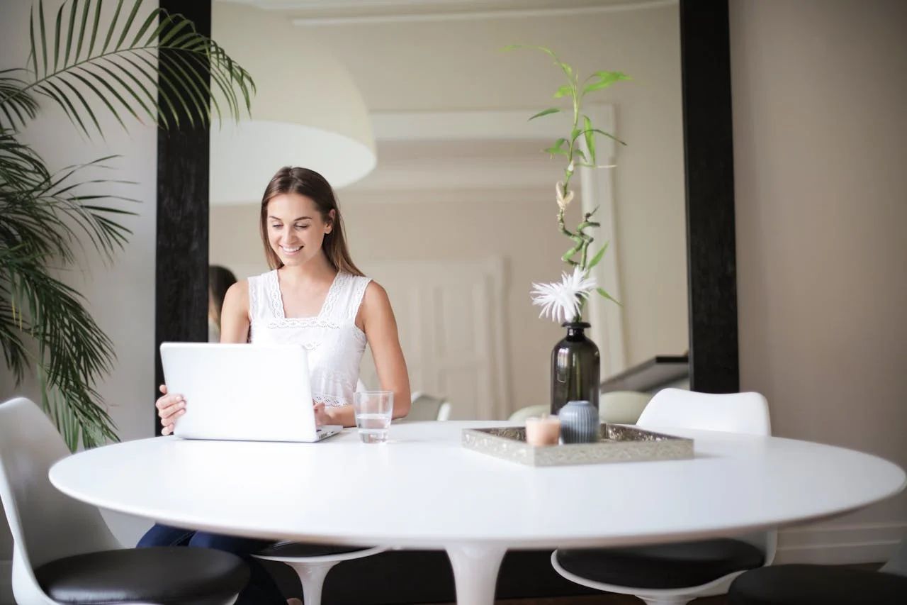 Hotels marketing remote work retreats to digital nomads with laptops and tropical views