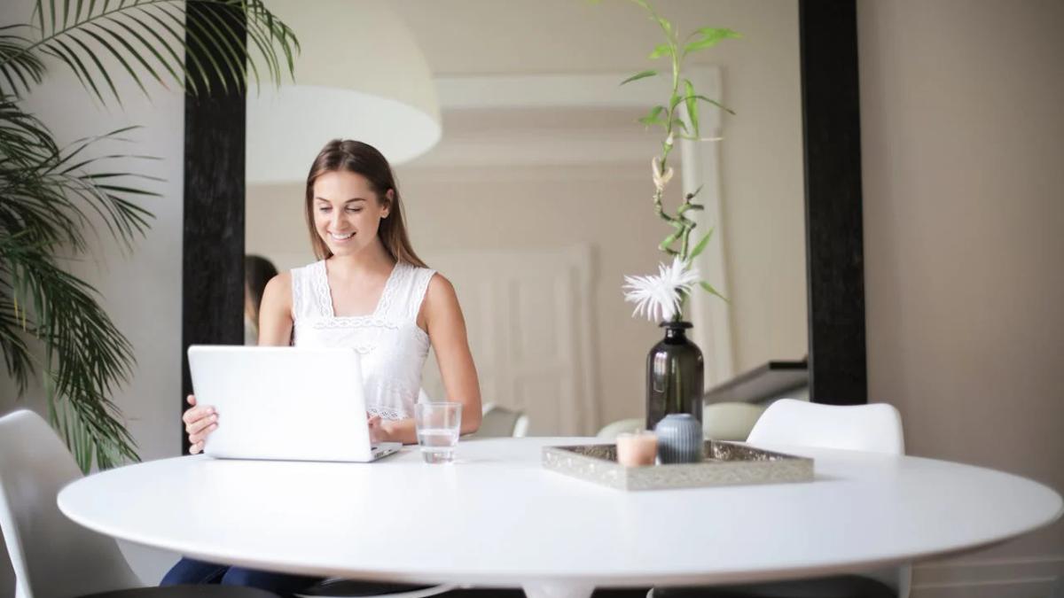Hotels marketing remote work retreats to digital nomads with laptops and tropical views