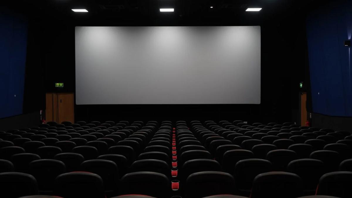 AMC Theatres logo illuminated as a sign of potential financial trouble