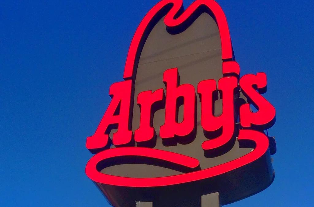 A smiling bag of Arby's food next to its stoic, unamused counterpart