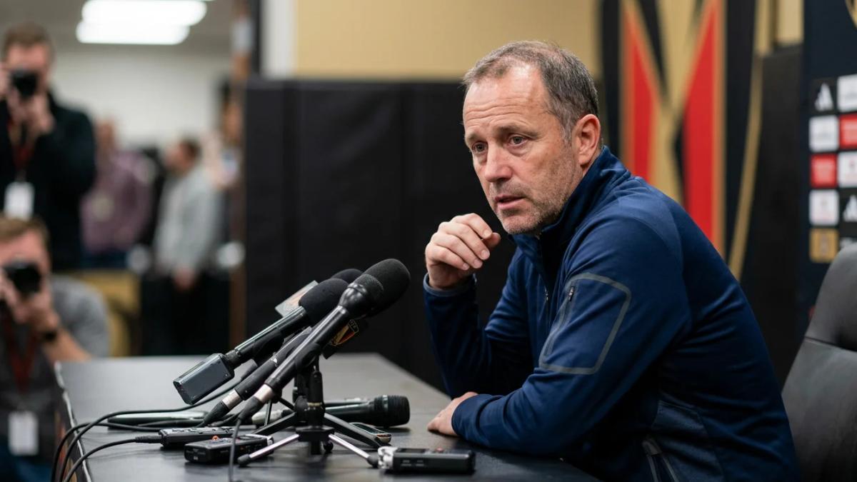 A distressed Frank de Boer speaks to reporters, apologizing for his controversial comments on equal pay