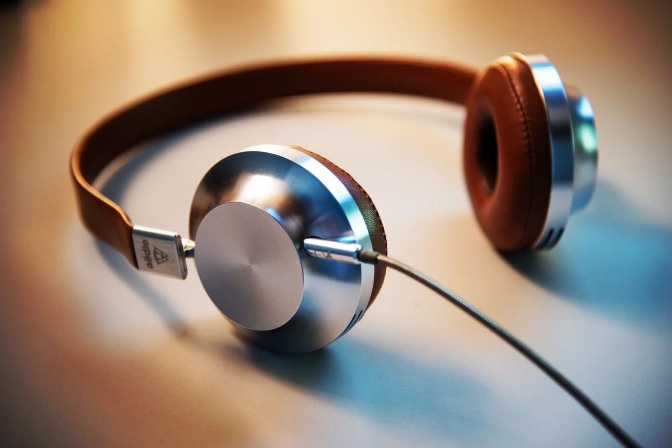 Colorful sound waves and headphones illustrate creative audio marketing strategies