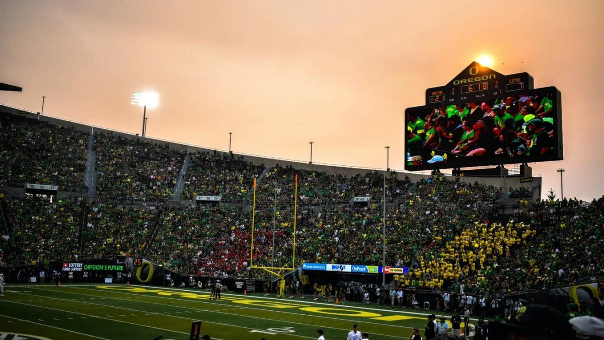 Football stadium filled with cheering fans, ready for the upcoming Big 10 season
