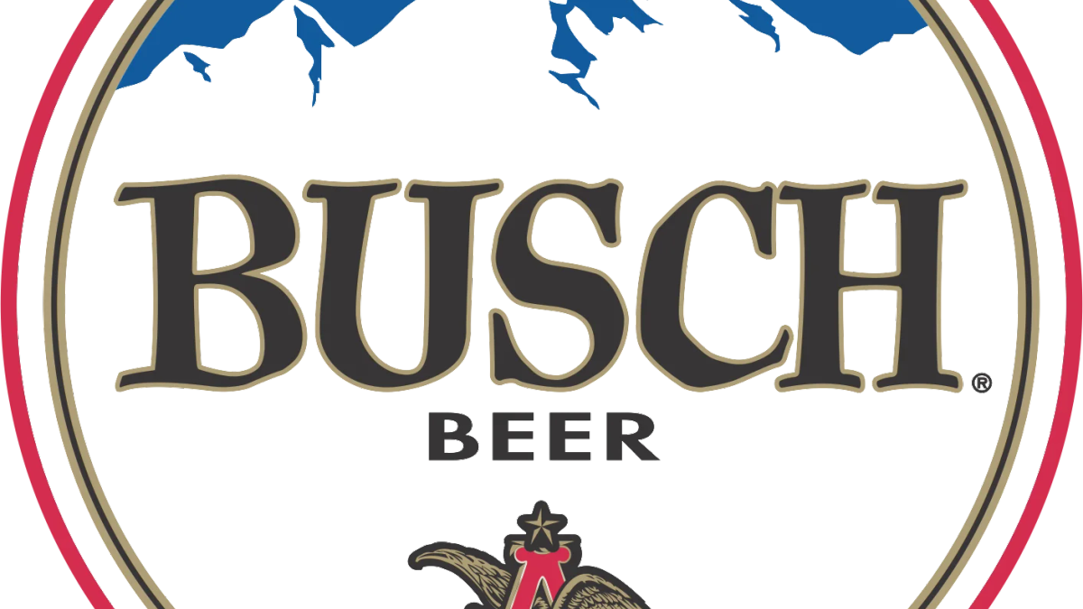 Busch beer cans and laptop on a desk, symbolizing new remote work environment
