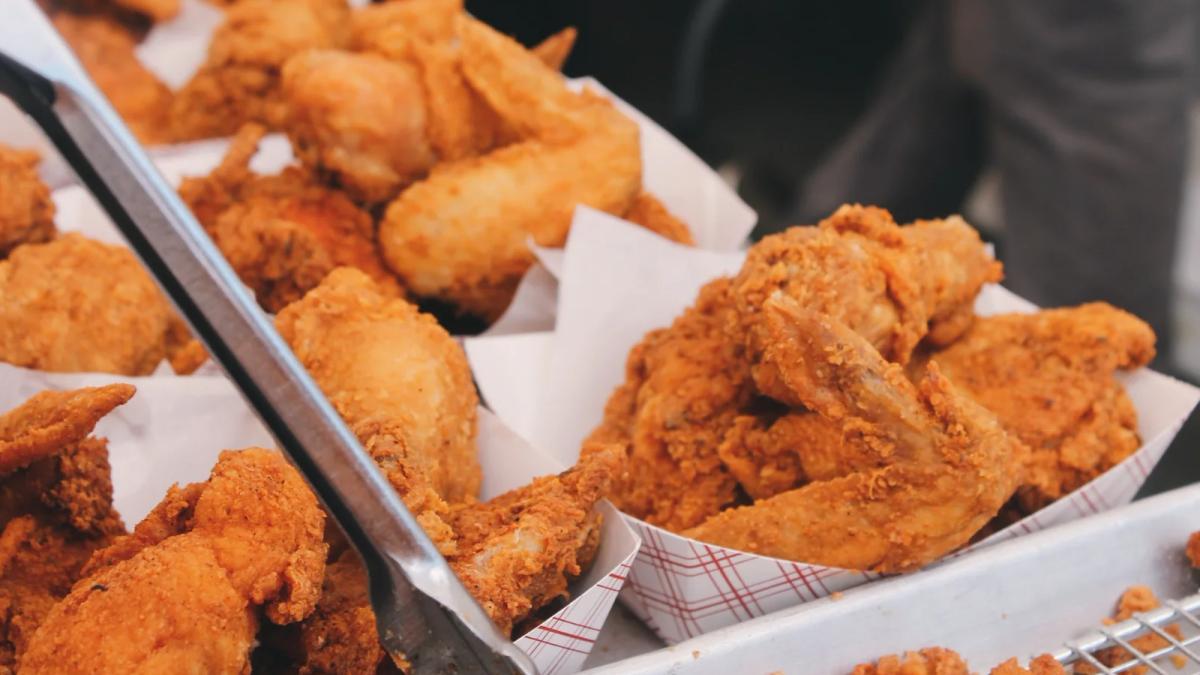 Chick-fil-A employee assembling meal kits showcasing convenient, fresh food ingredients for customers