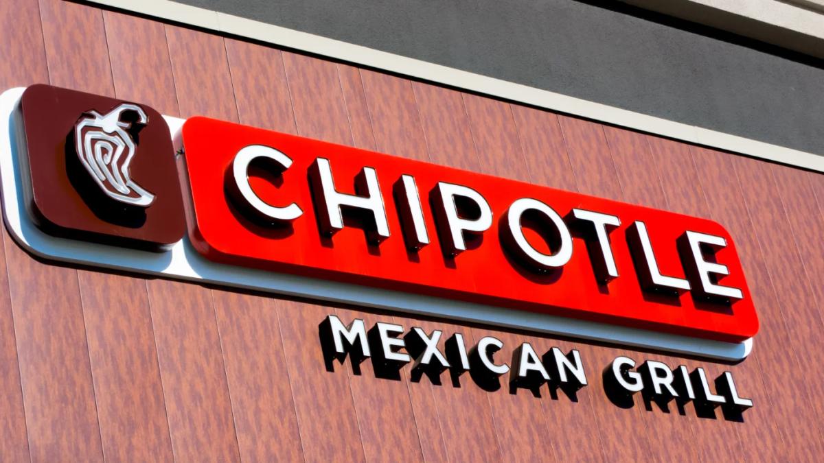 Sick person clutching stomach, symbolizing Chipotle's food safety issues